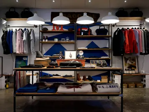 Boutique clothing store with racks and shelves